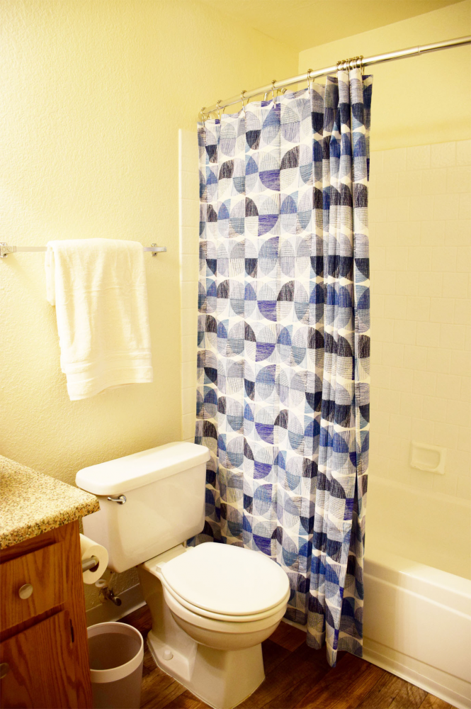 This Bedroom and bathroom 1 photo can be viewed in person at the Walnut Village Apartments, so make a reservation and stop in today.